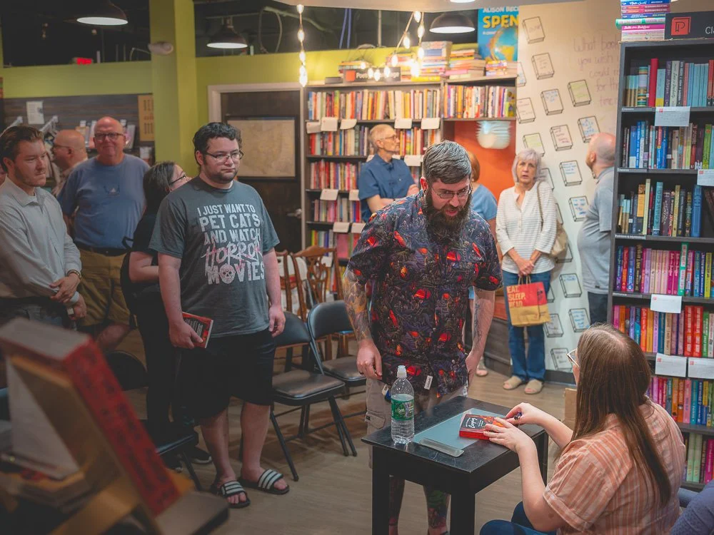 Readers waiting while Bonnie Quinn signs a book at Prologue Bookshop