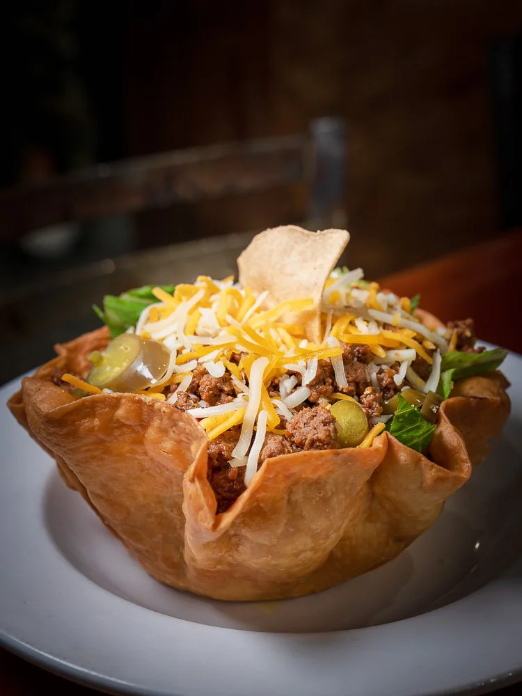 Taco salad served in a crisp tortilla bowl