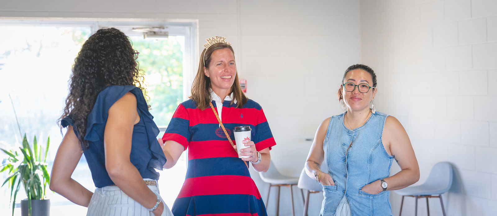 Three Sanctuary Columbus members talking before a gathering