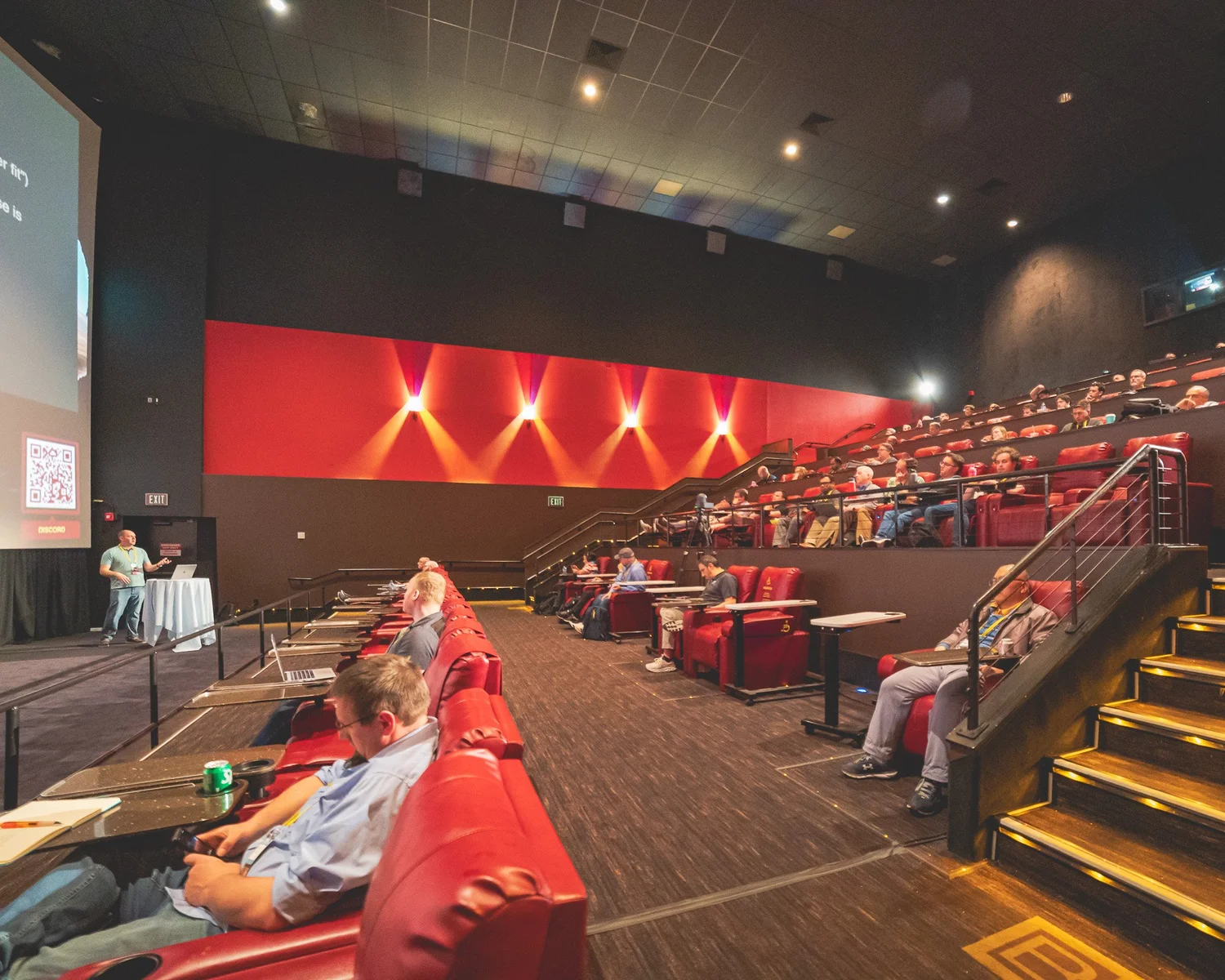 A wide view of a technical session inside an AMC theater